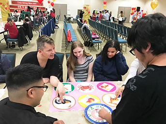 UC Irvine facultly and students play Vietnamese craps at a Lunar New Year celebration in 2020