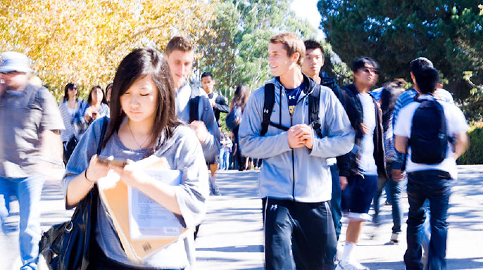 Students walk across UC Irvine campus