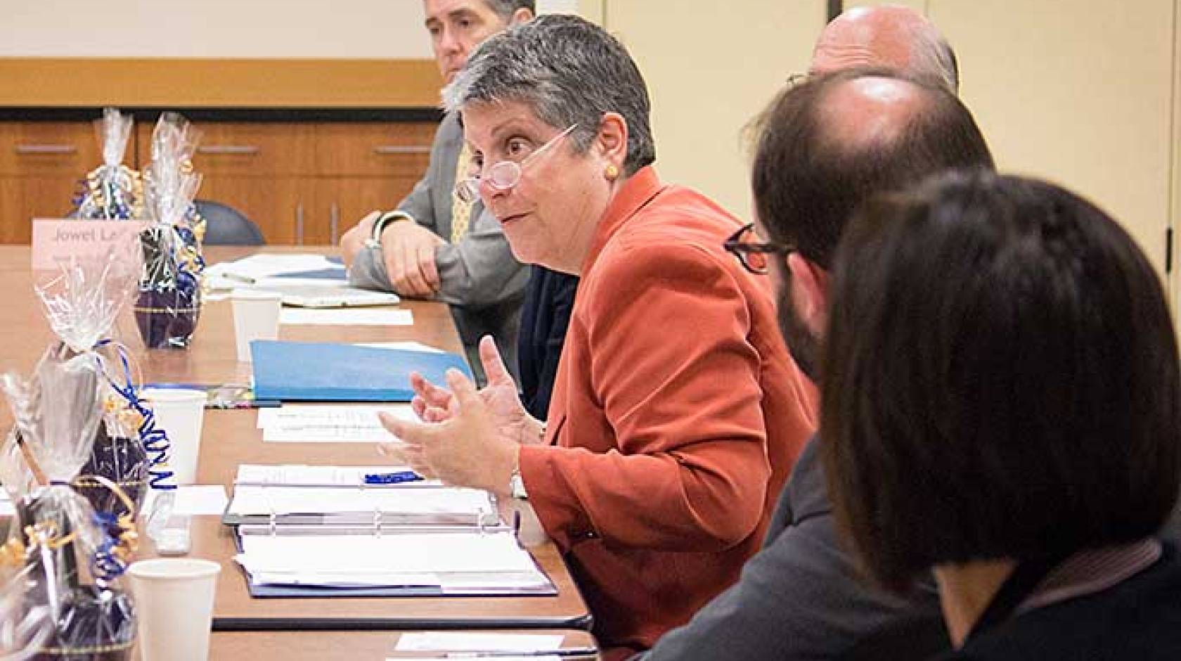 Janet Napolitano and community college officials