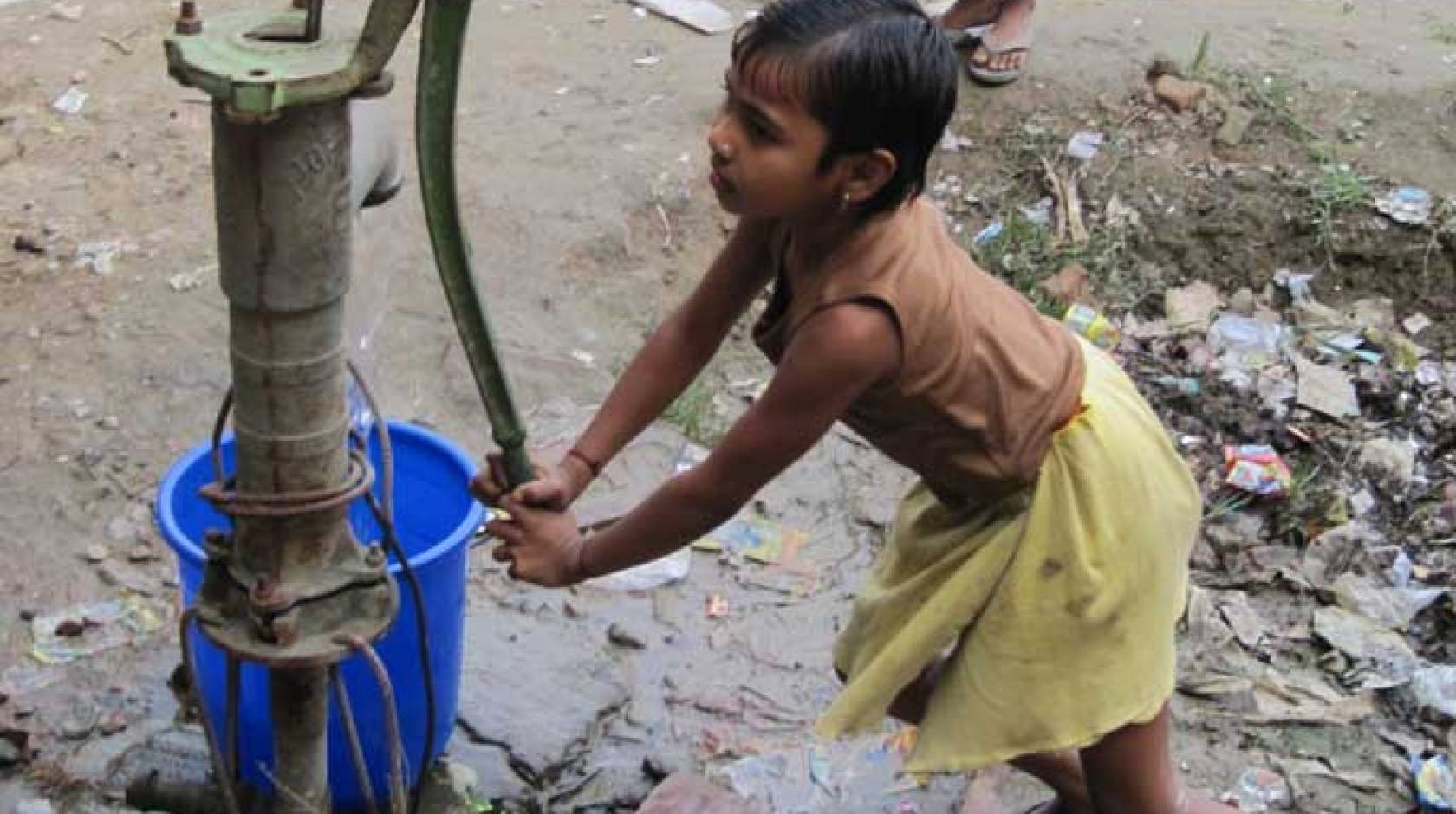 girl pumping water