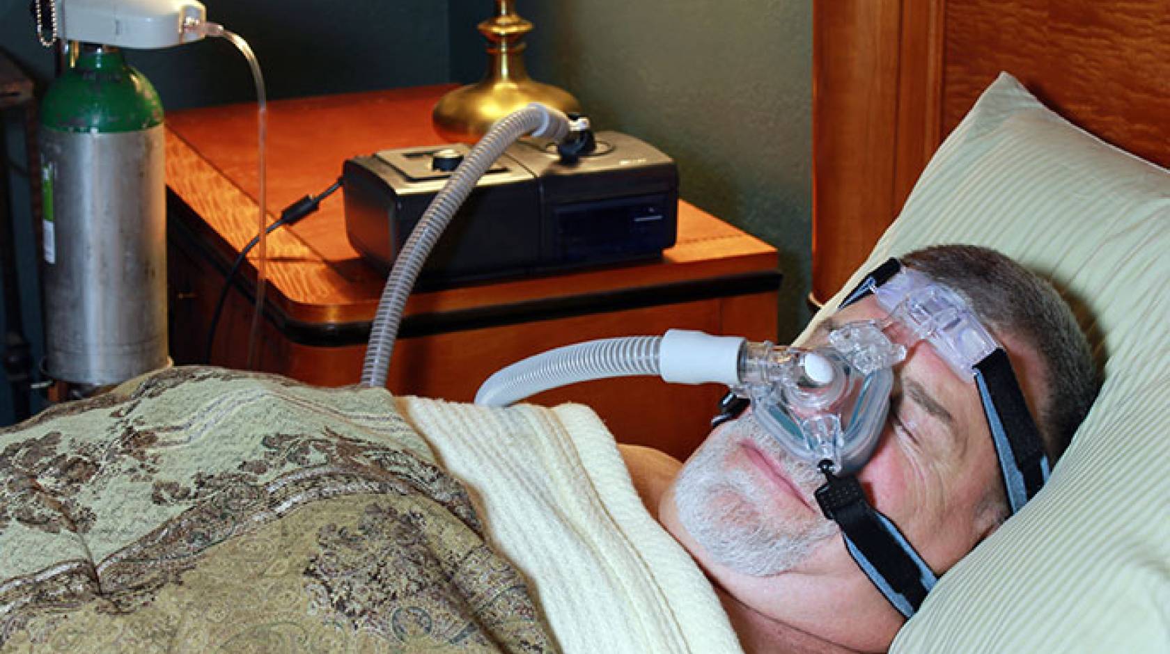 man with CPAP machine