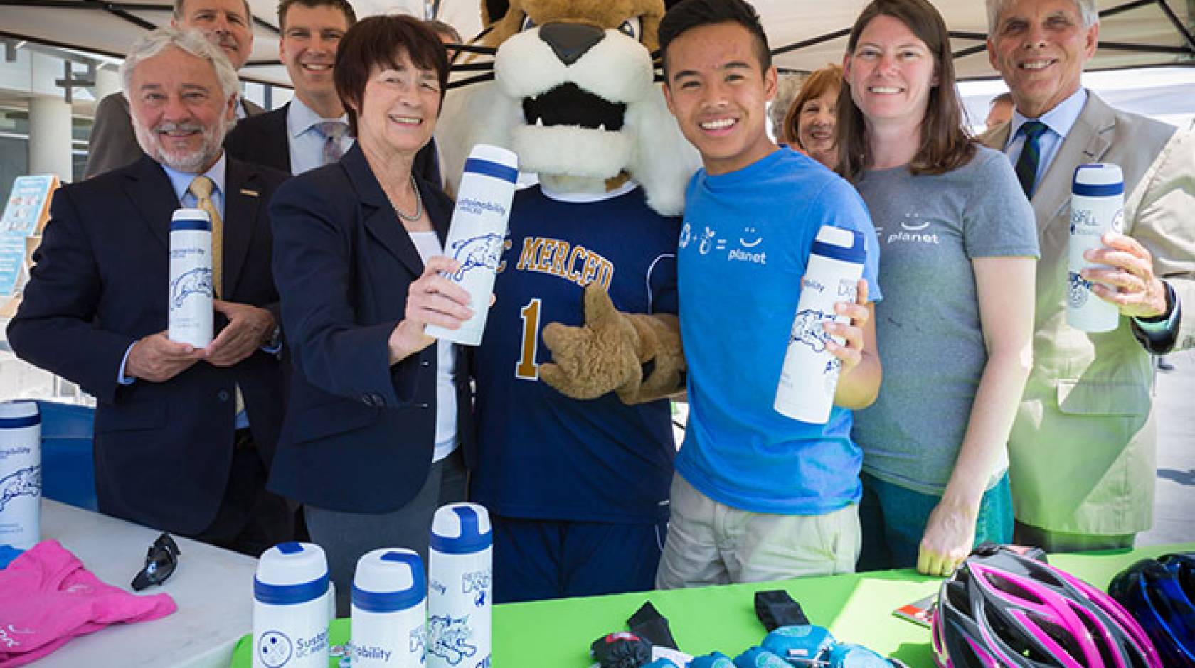 UC Global Food Initiative fellow Hoaithi Dang (right of mascot) is doing his part to make UC Merced a green campus.