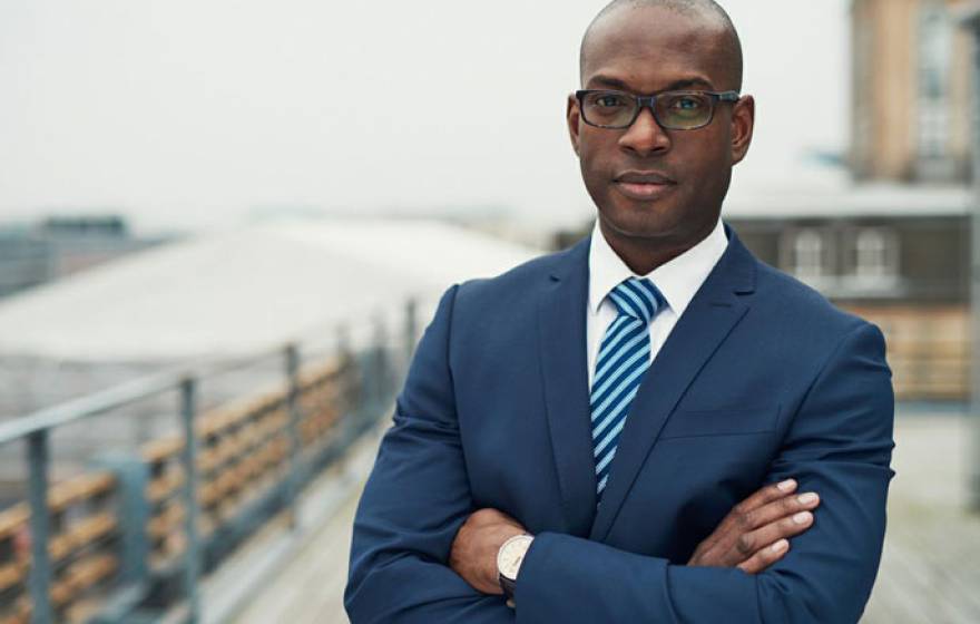 Young Black professional in blue suit