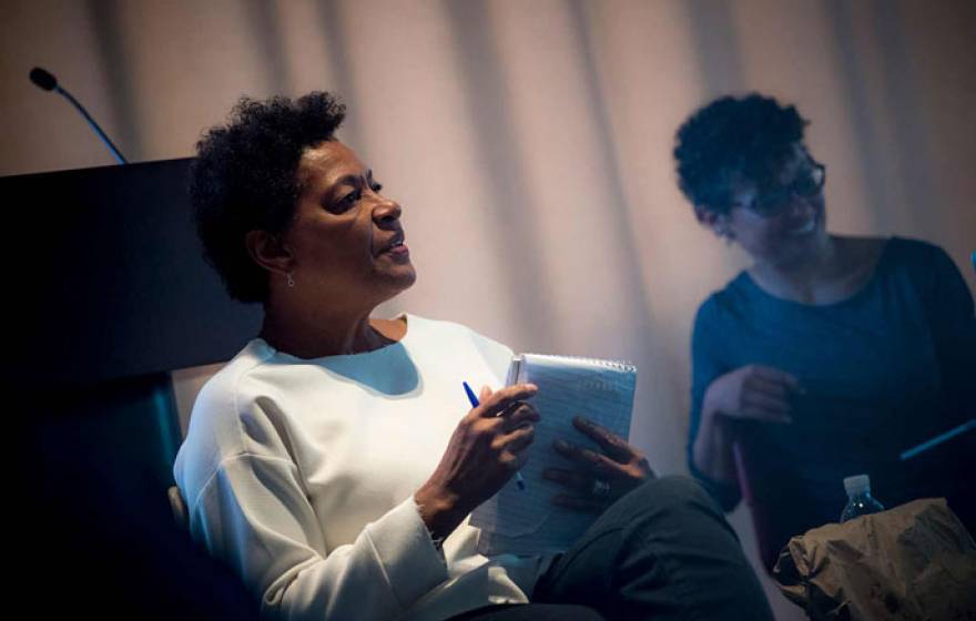 Carrie Mae Weems holds a notepad