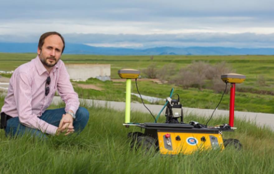 UC Merced professor Stefano Carpin and one of his robots