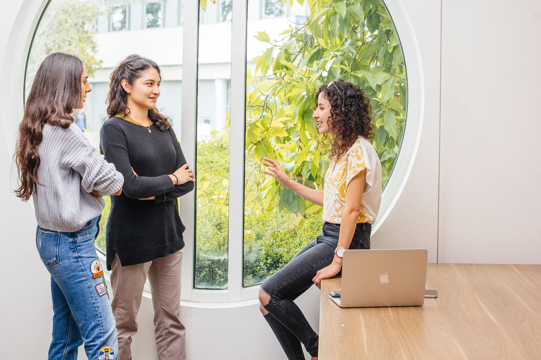 Three woman talking during a meeting