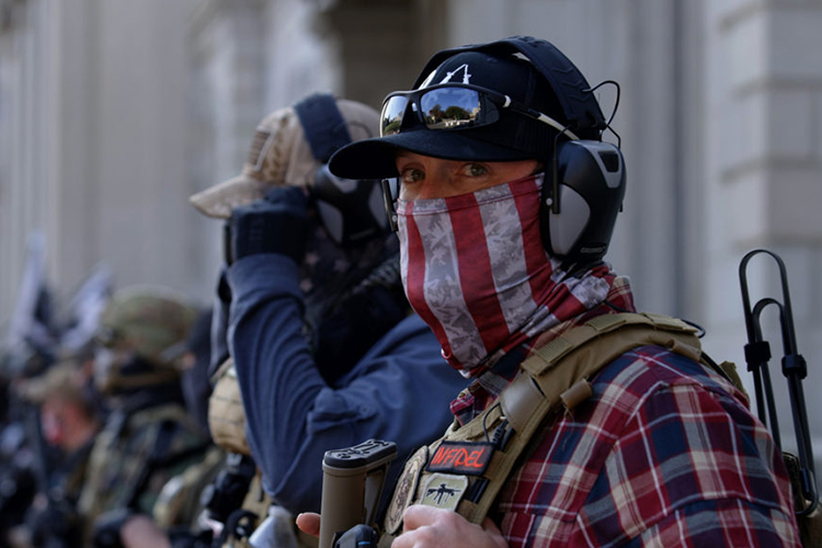 A person in a mask at the insurrection at the US Capitol, Jan. 6, 2021