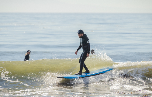 Man standing on surfboard