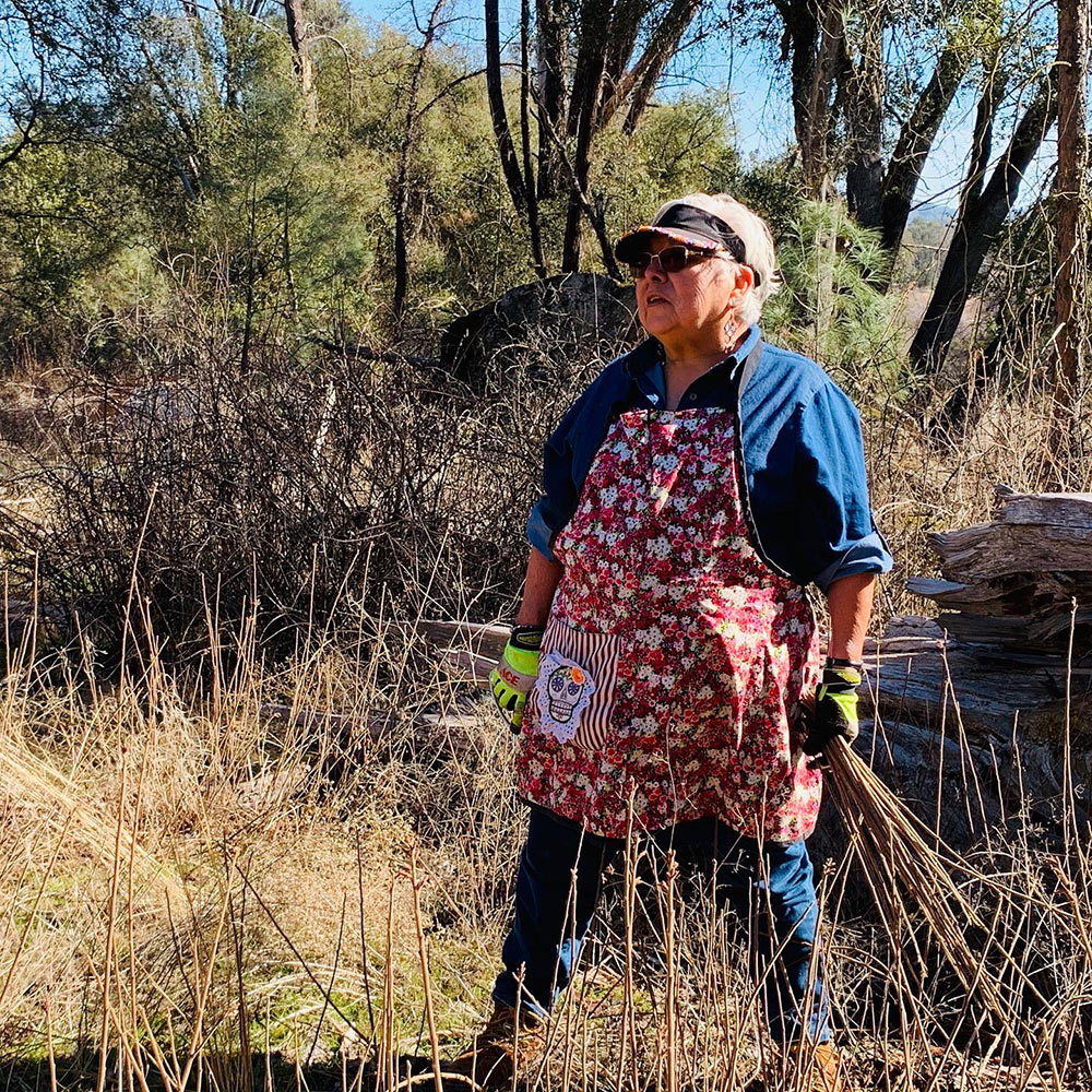 Julie Dick Tex collecting sourberry branches for basket making