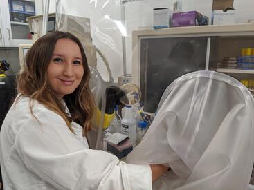 Monica McNamara counting anaerobic plates in the lab