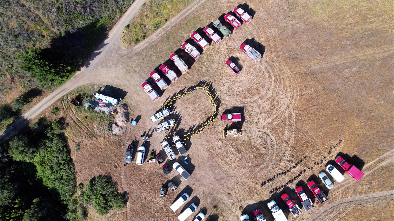 Cars aligned around a staging location for the training academy