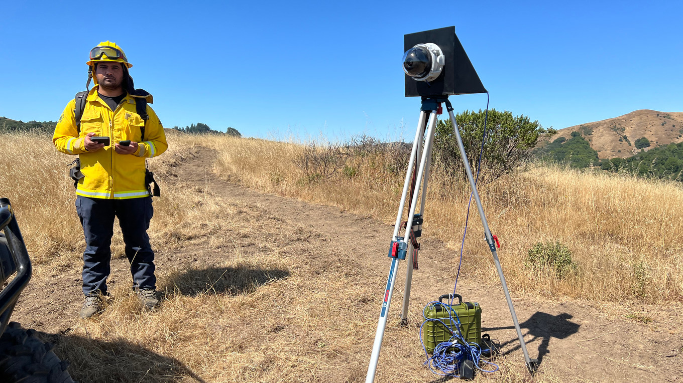 Firefighter setting up an outdoor camera