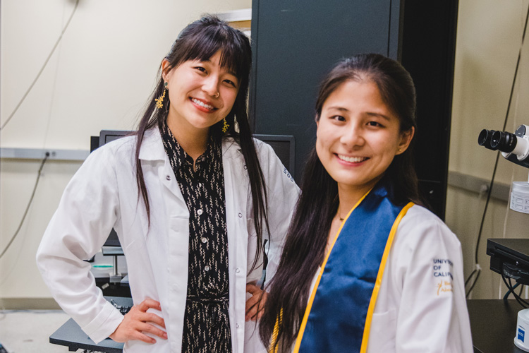 Christine Liu and Yichen Zhu in the lab of Stephan Lammel, Zhu in her graduation stole