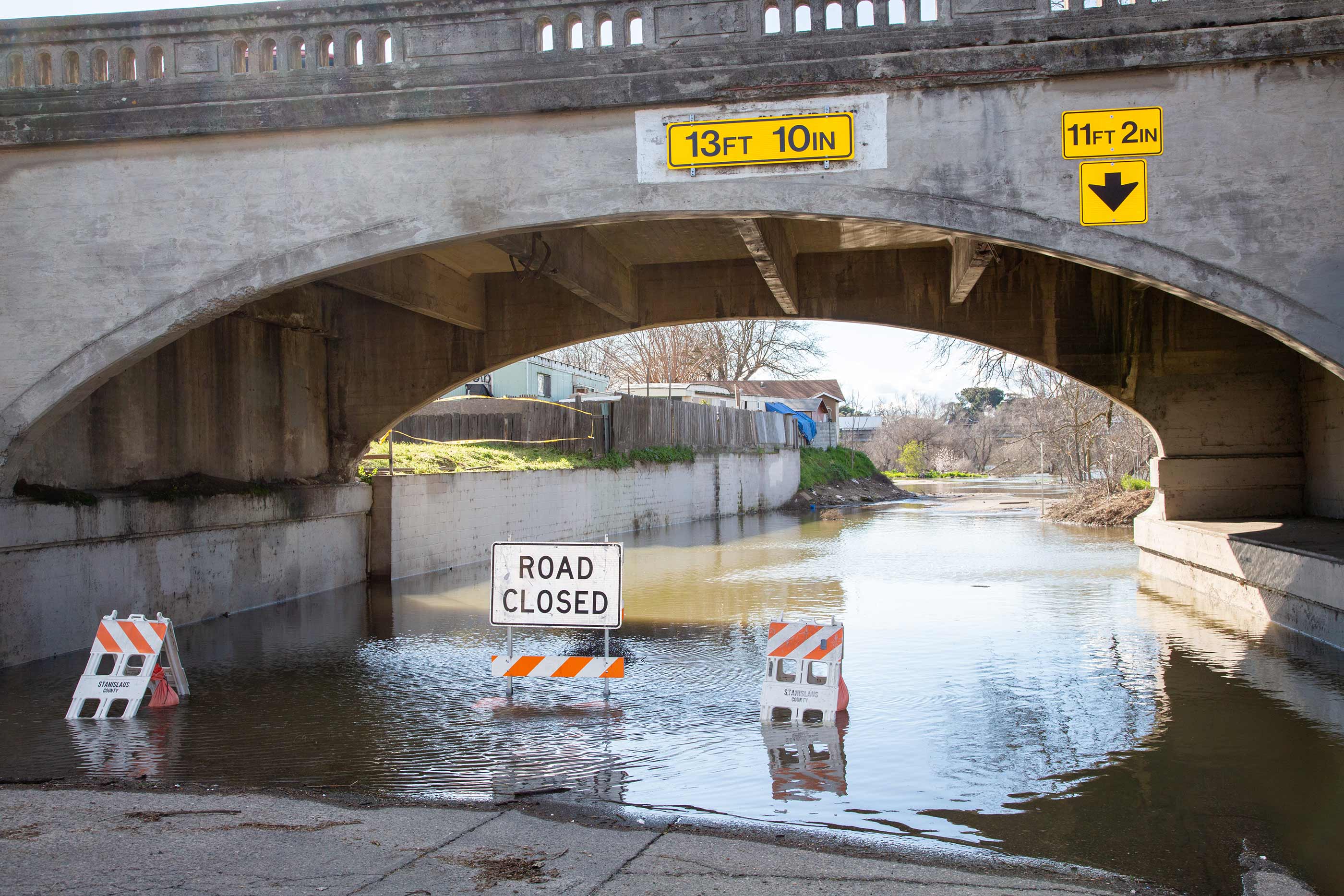 Flooded road under a bridge in Modesto