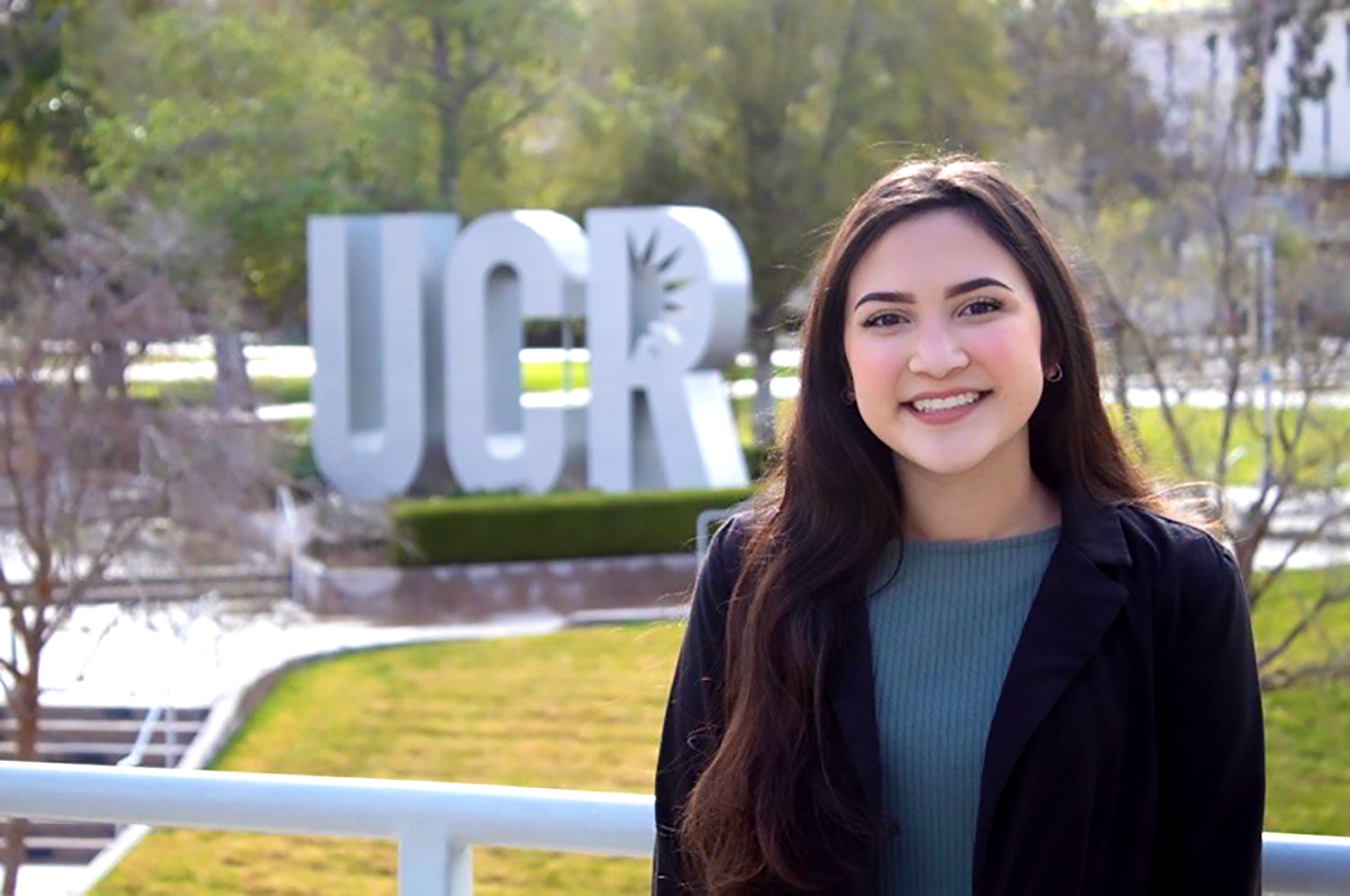 Alondra Martinez with UCR sign in the background
