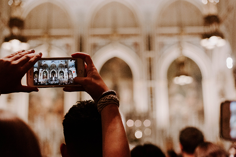 Someone holding a smartphone in a church