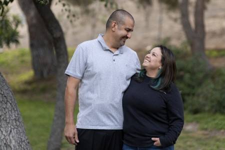 Lazaro Barajas and his wife, Gladys, with their arms around each other.