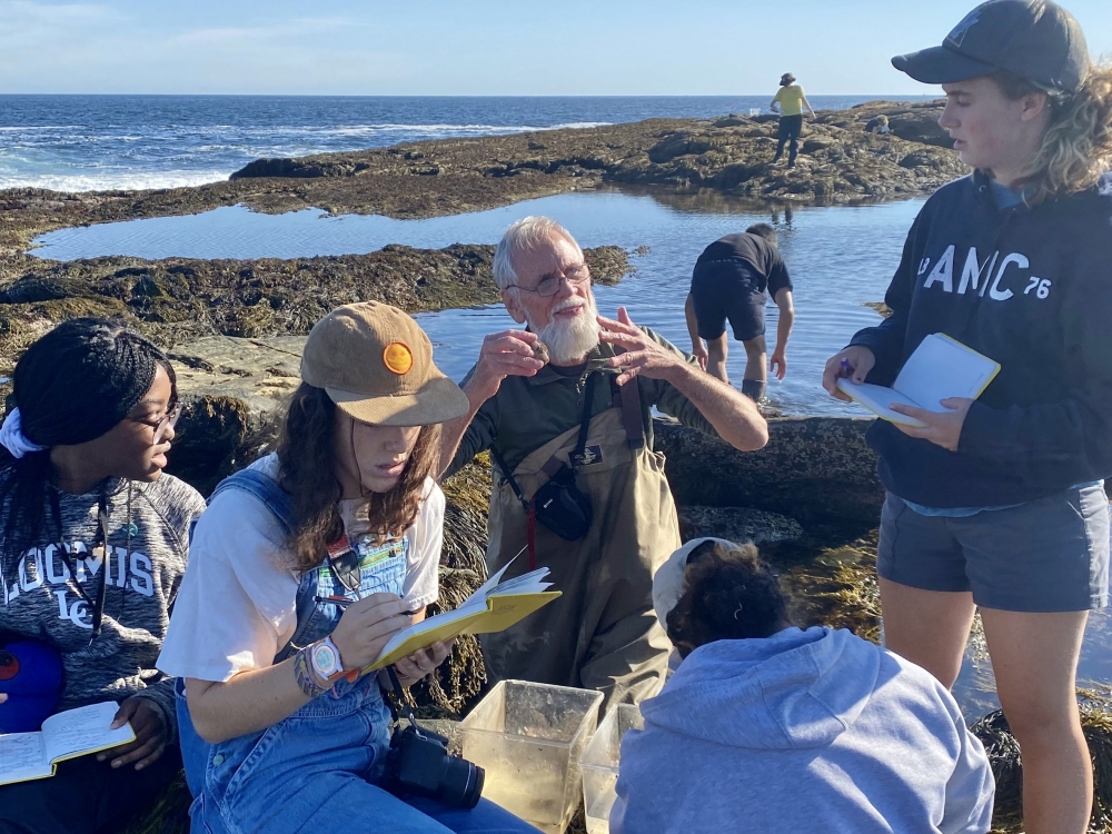 Jeff Goddard with students at a tidepool