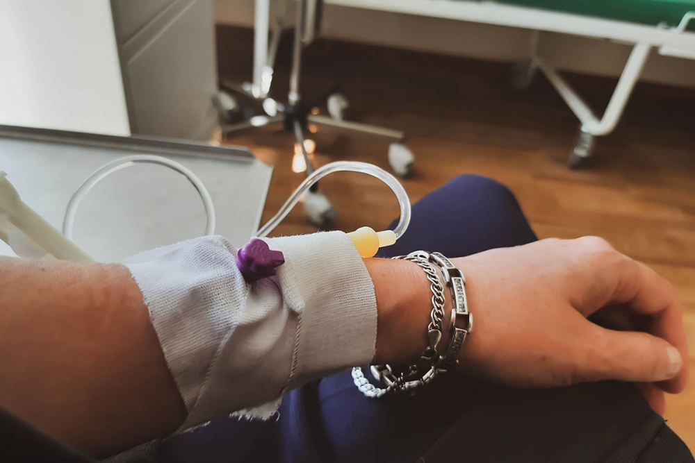 A view of someone receiving chemotherapy through their arm