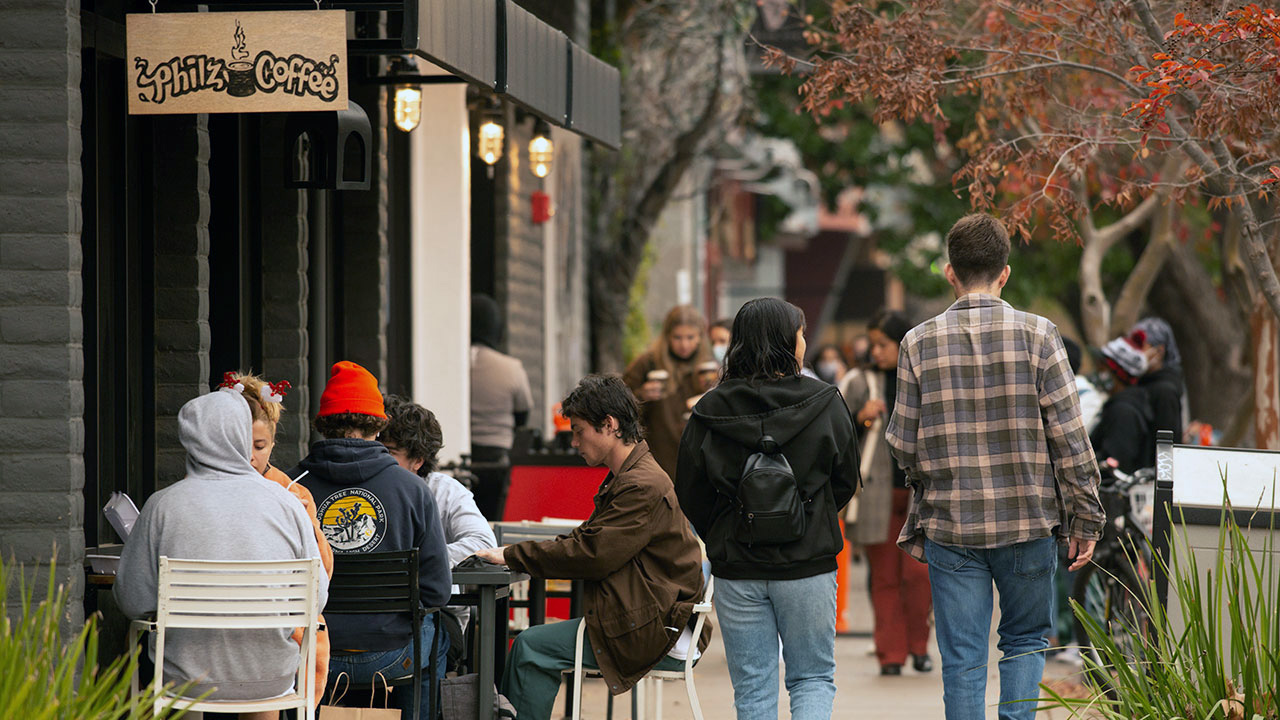 Students walking on a street in downtown Davis