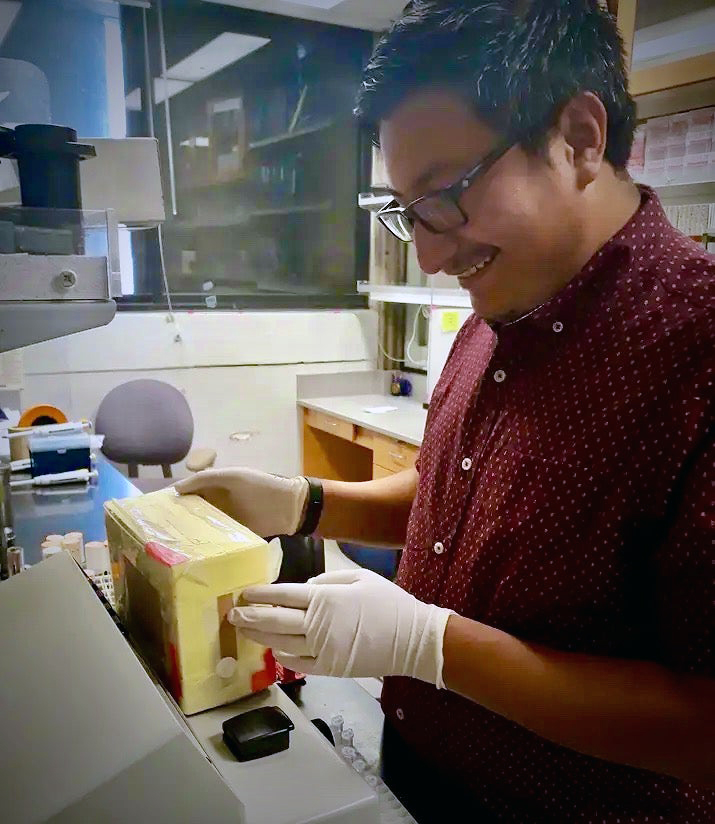 UC Davis graduate student Gabriel Subuyuj in the lab