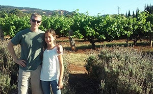 Kurt Schwabe and his daughter at a vineyard in Australia
