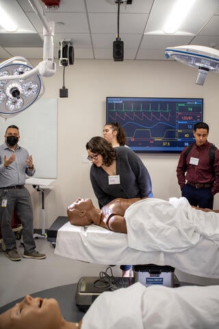 Community college students visit a lab with human dummies in the UC Riverside School of Medicine.