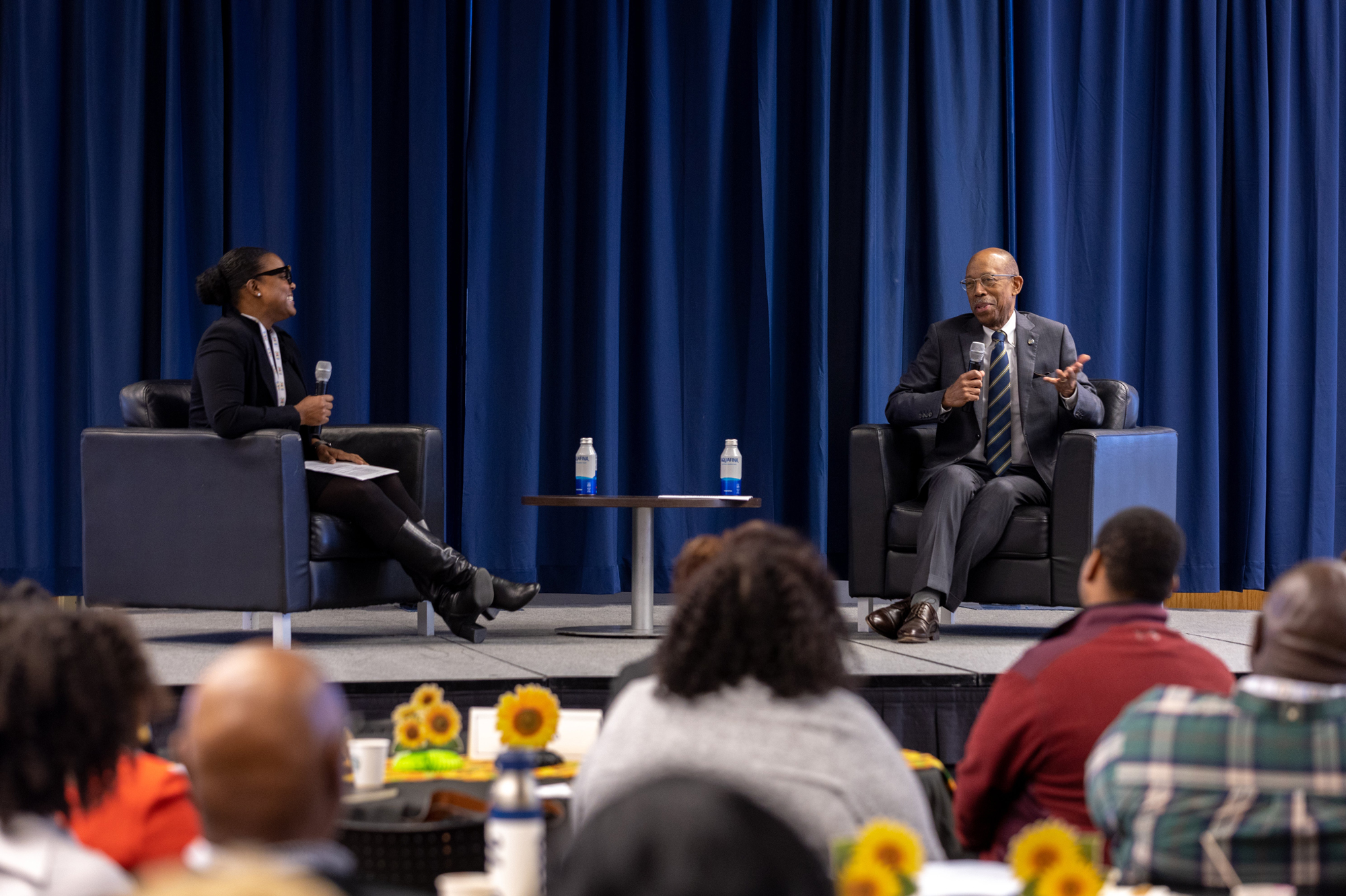 Professor Rall and President Drake share a laugh at a UC Riverside panel