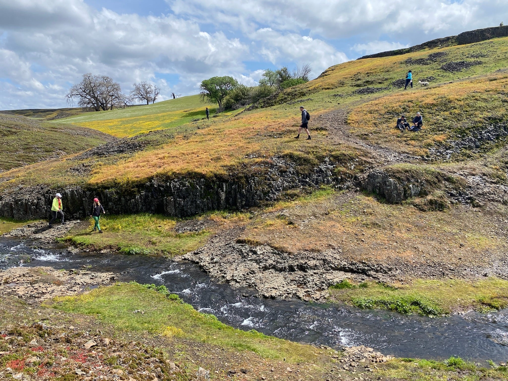 Hikers walking along a hill in the North Table Mountain Ecological Reserve