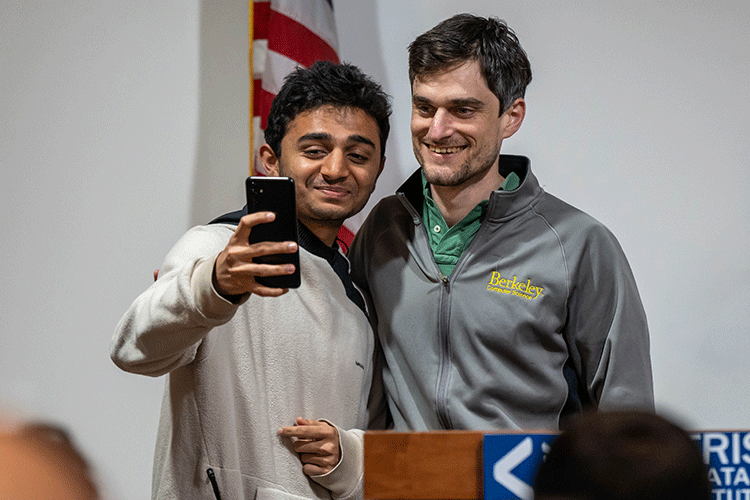 John Schulman poses with a student for a selfie