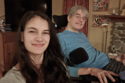 Catey Vera takes a selfie with her father in a wheelchair