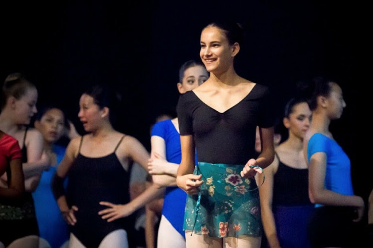 Catey Vera as a teenager, at a ballet rehearsal in 2014 with other teenagers