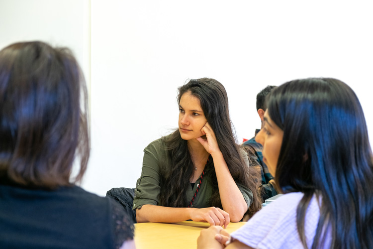 Vera with fellow volunteers at a table at UC Berkeley’s Human Rights Center