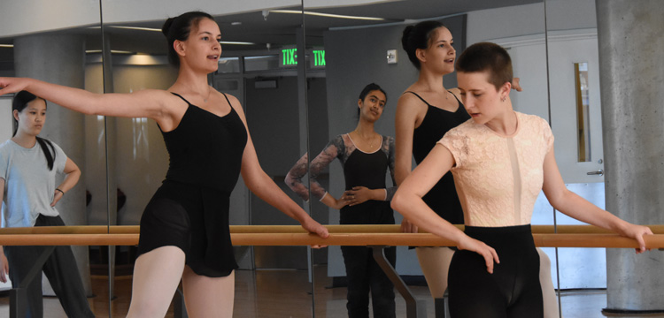 Catey teaching a ballet class to a few students