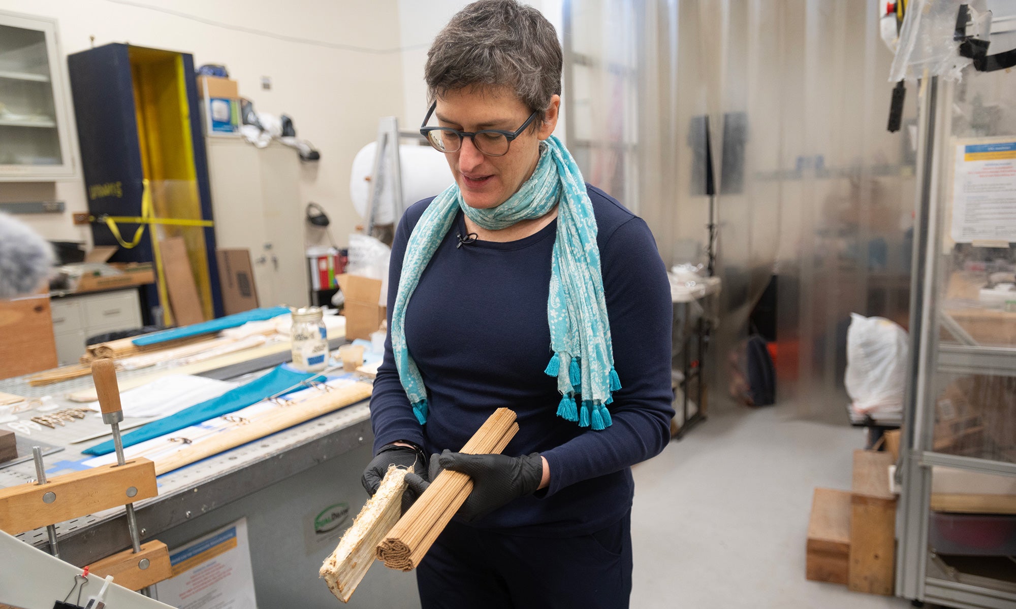Valeria La Saponara holds materials for a compostable wind turbine in the lab