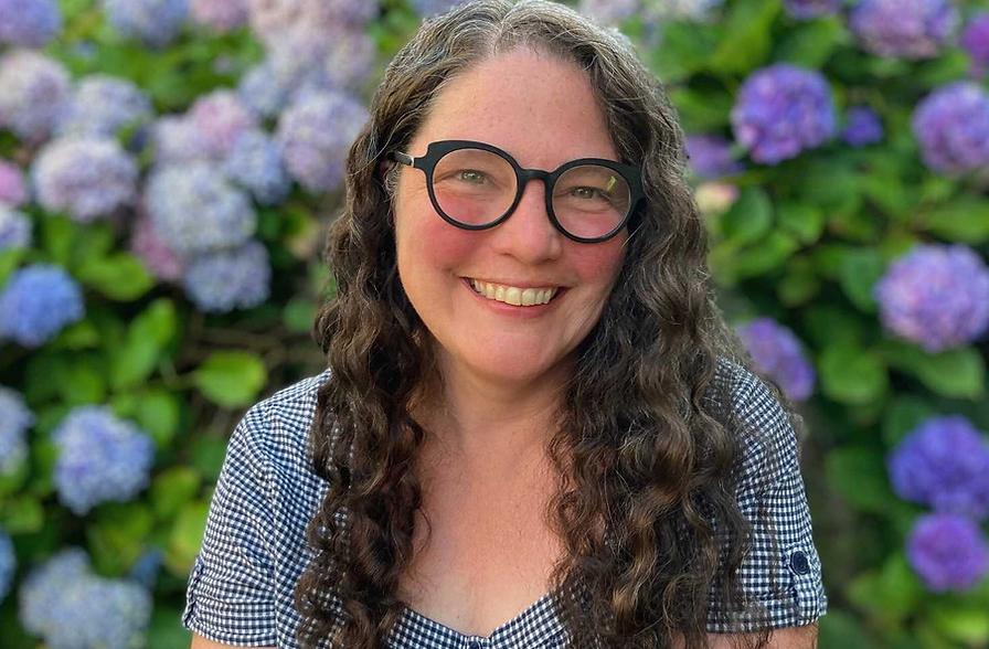 Amber Szoboszlai with flowers in background