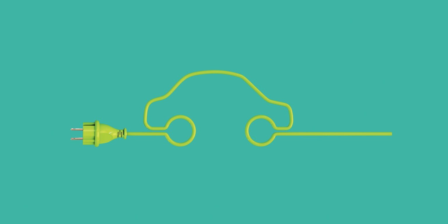 An illustration of a car on a street made from an electric plug coiled around just so