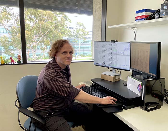 A person at a computer in an office