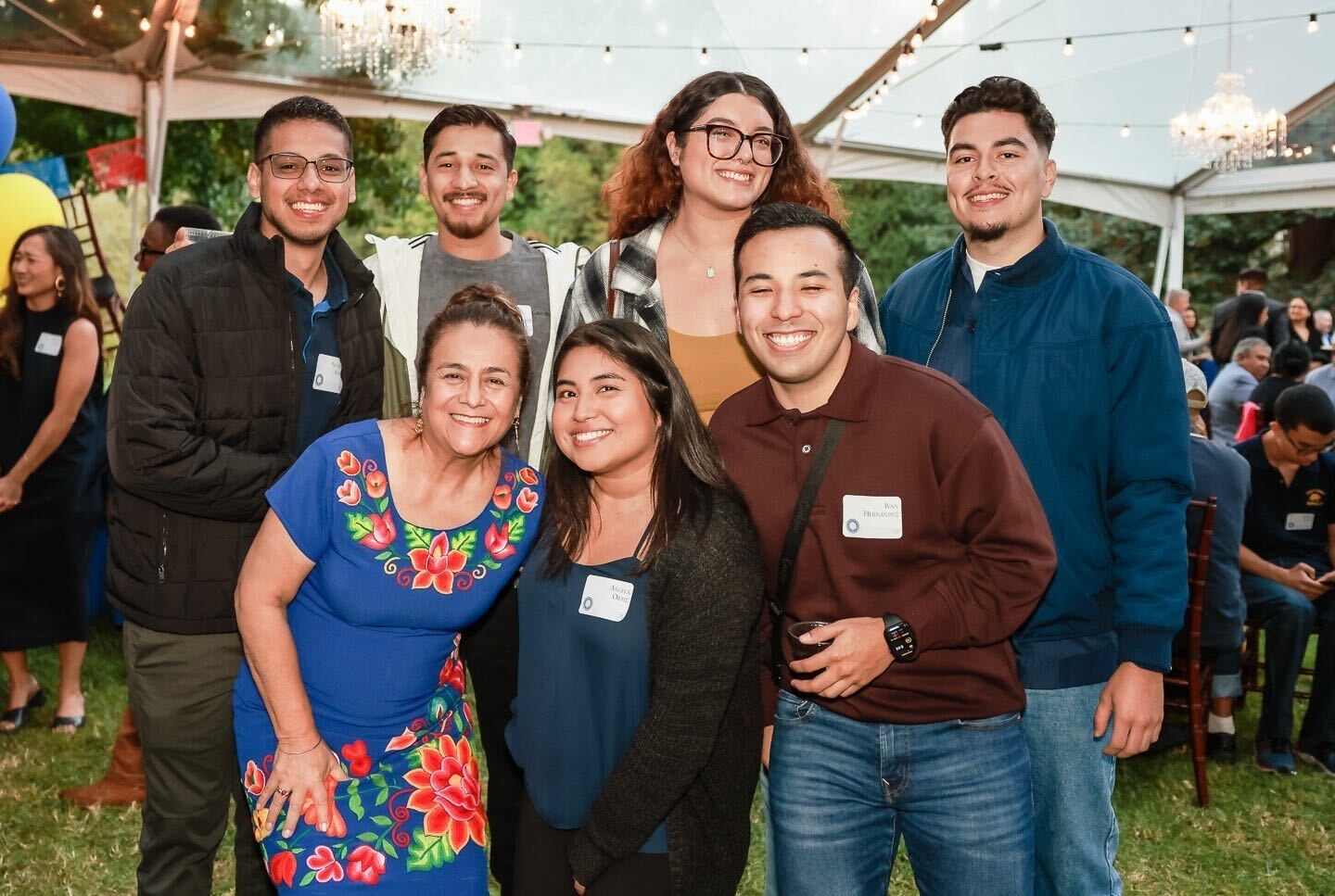 a group of people posing at a party