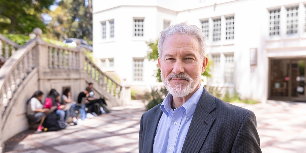 Rich Lyons, white man with white beard on UC Berkeley campus