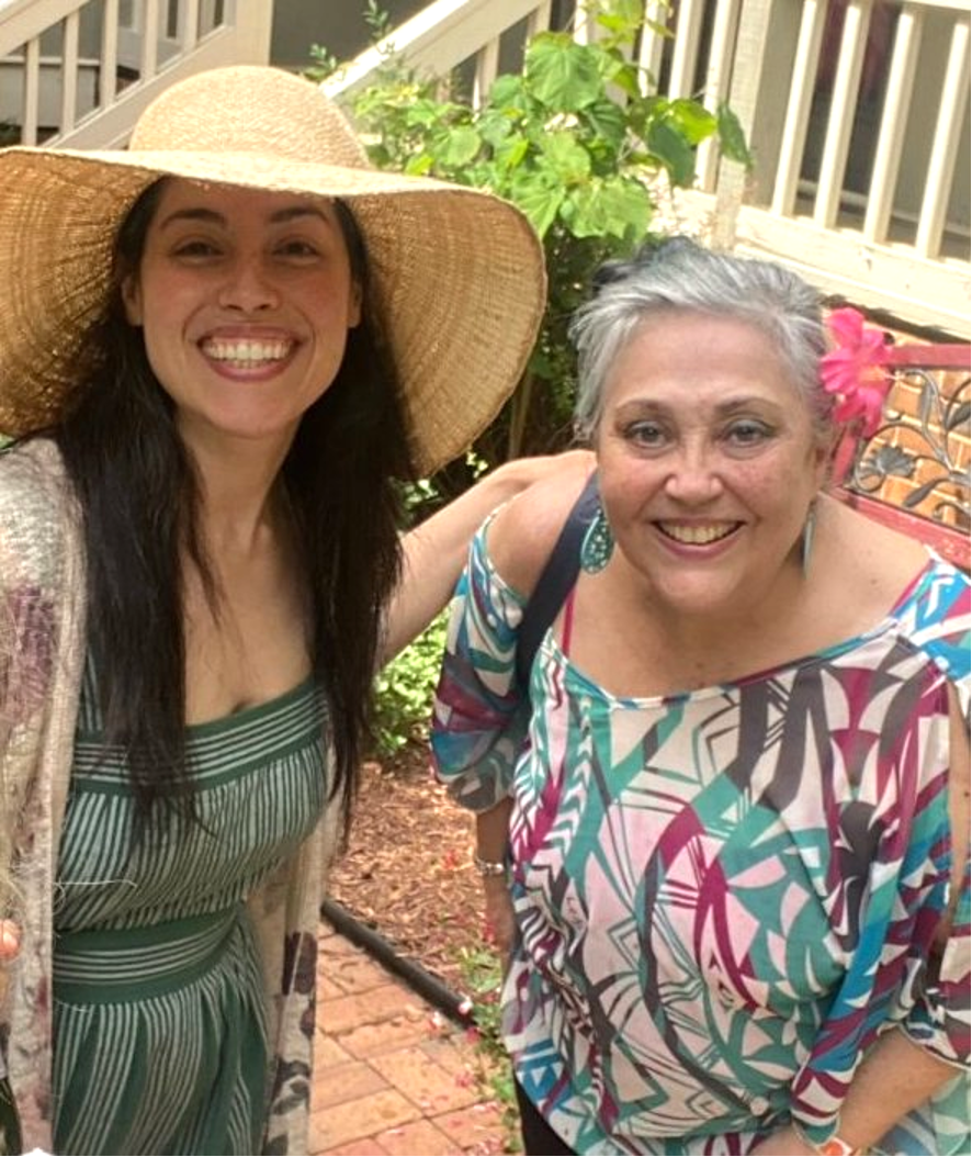 Rosa W. Everson, a young Latina woman, with her mom, who has short gray hair. Both smiling