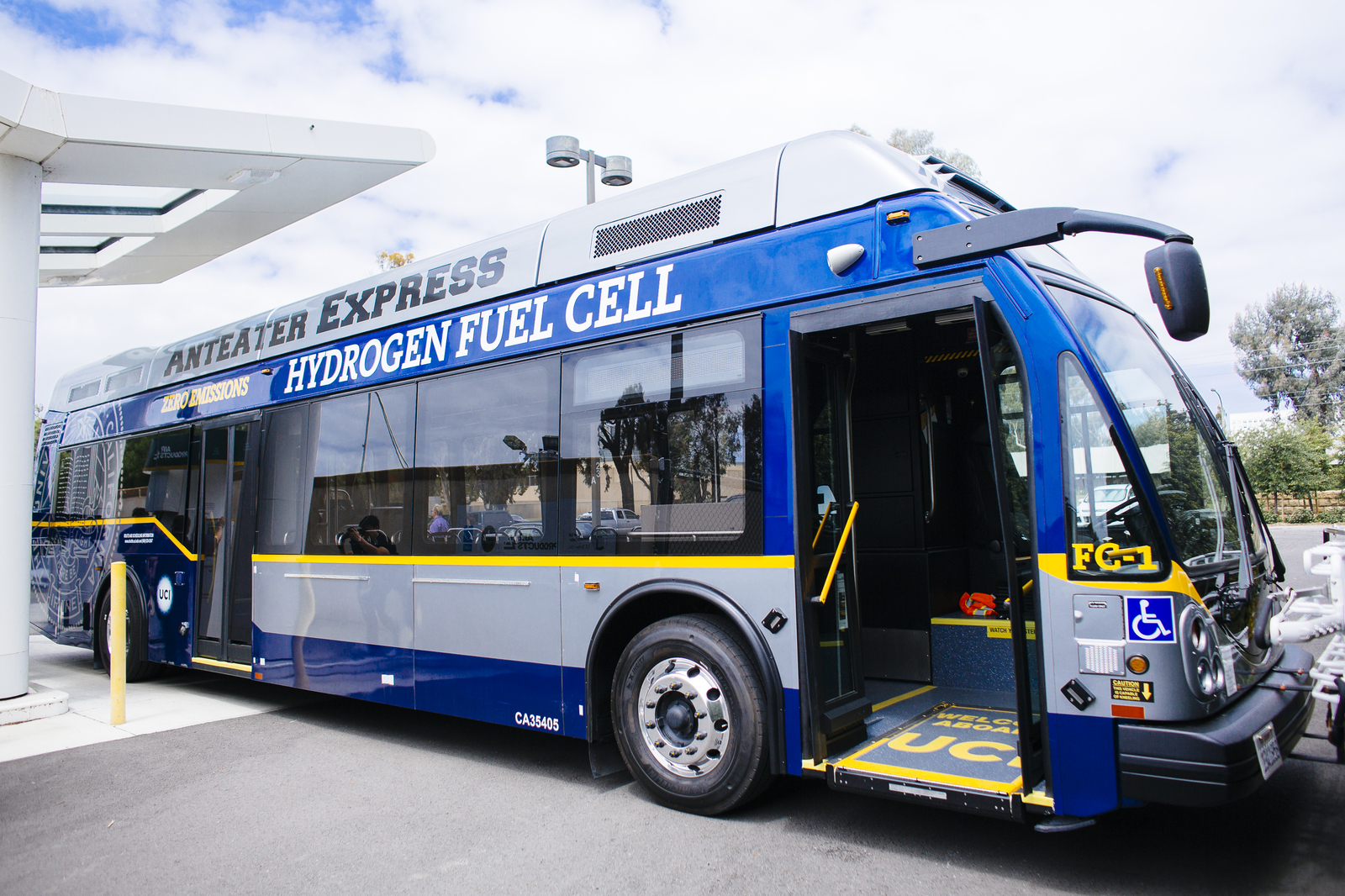 A fuel cell bus, painted blue, silver and yellow, with "ANTEATER EXPRESS" written on the roof
