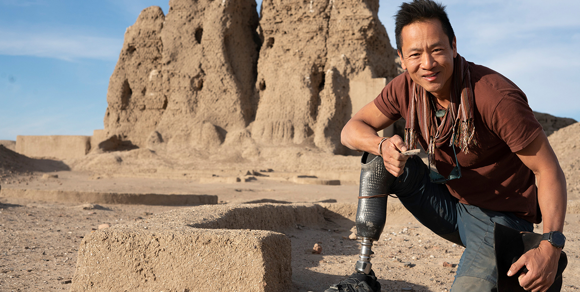 Albert Lin outdoors at a ruin near Kush