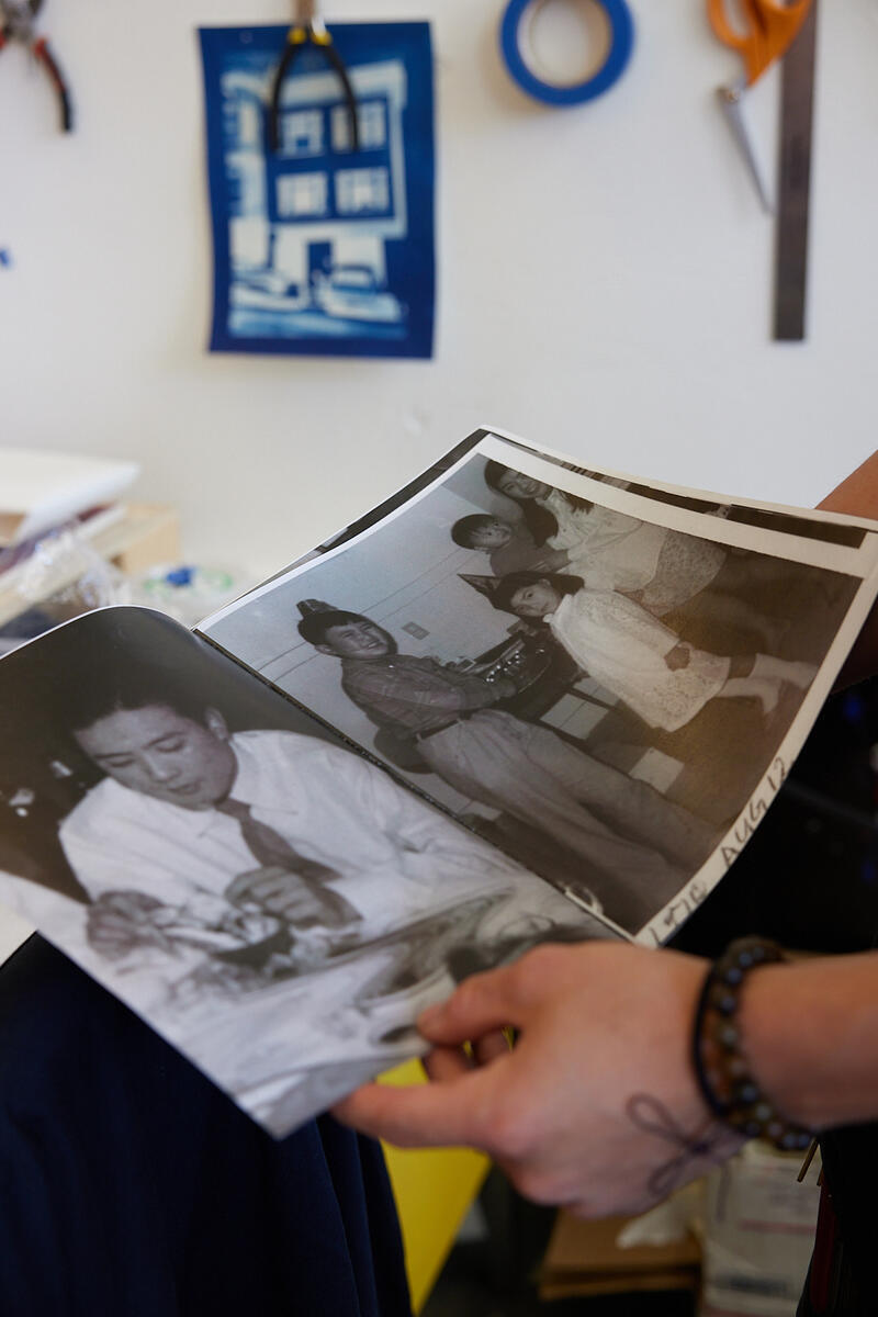 hands holding family photographs