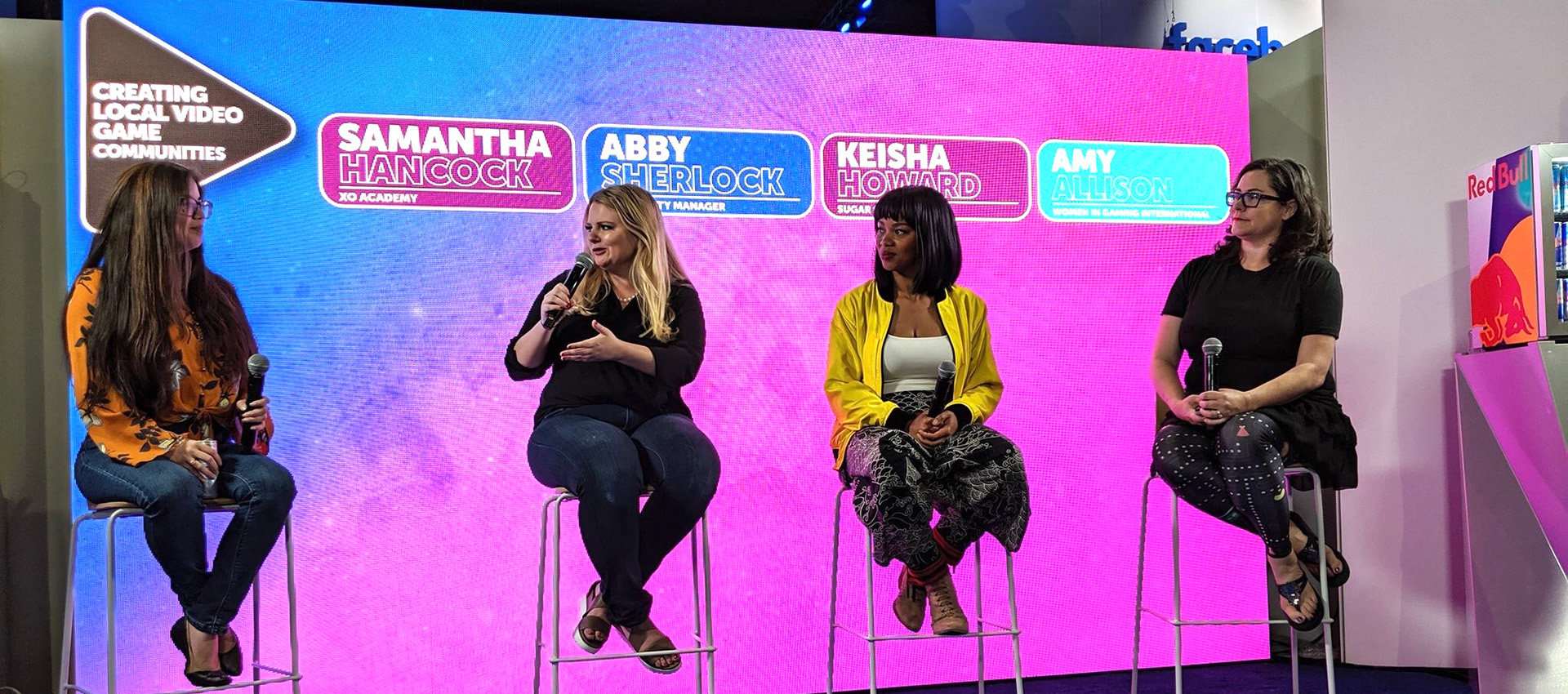 Abby Sherlock and three other women participating in a gaming panel discussion