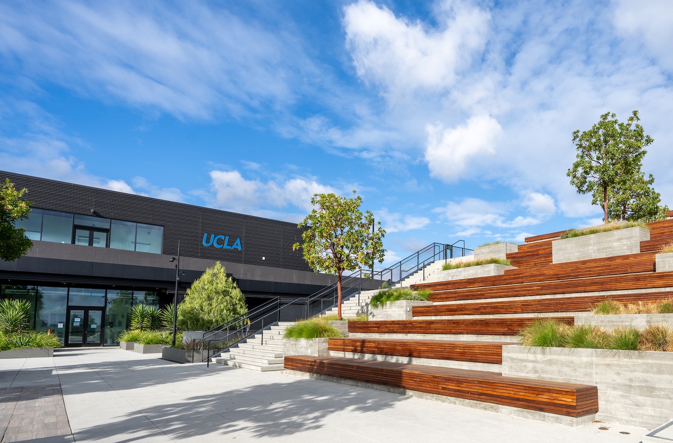 Outdoor view of transformed Westfield mall, with outdoor seating under blue skies