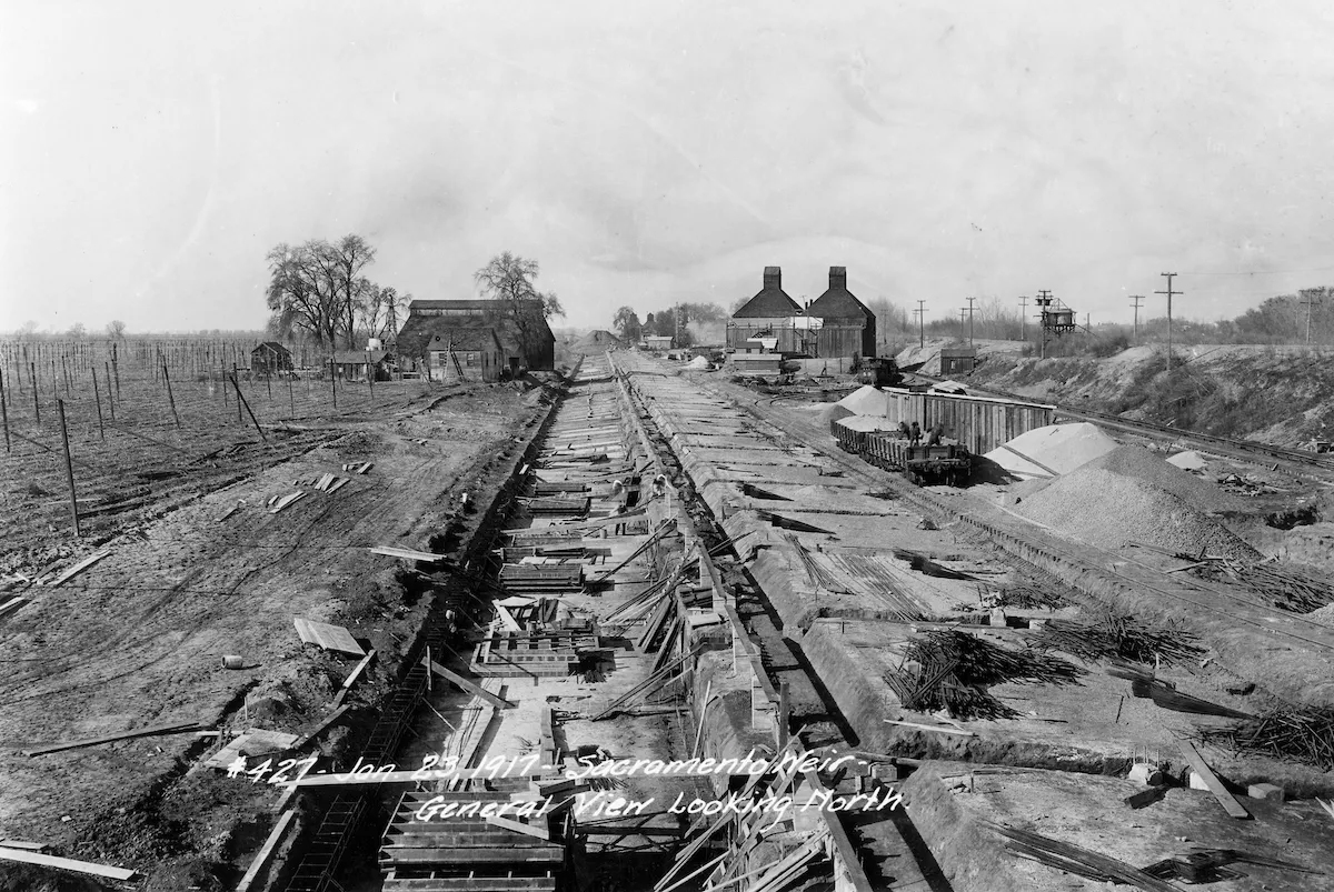 foundations of the Sacramento Weir, a concrete flood overflow structure, during construction