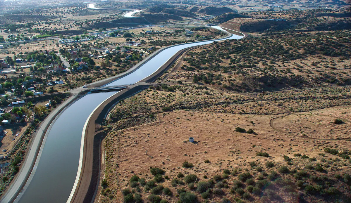 aerial view of an aqueduct flowing through mixed-use land