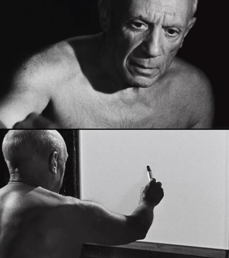Footage of Pablo Picasso drawing in his studio, highly focused