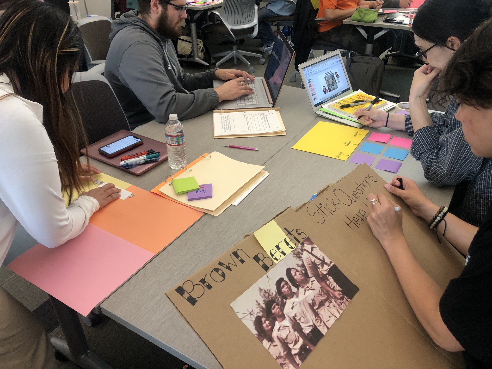 Graduate students working on craft projects that can be used to teach ethnic studies in the classroom